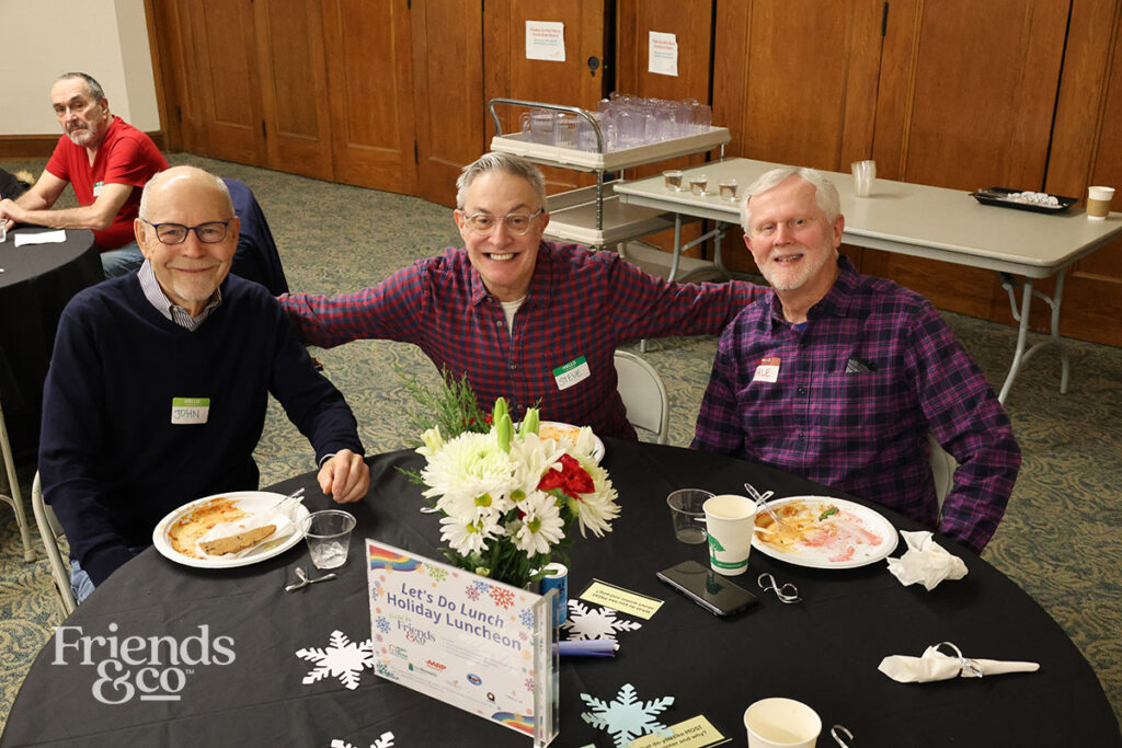 Gay friends at Friends & Co queer holiday luncheon for older adults in the Twin Cities 2025