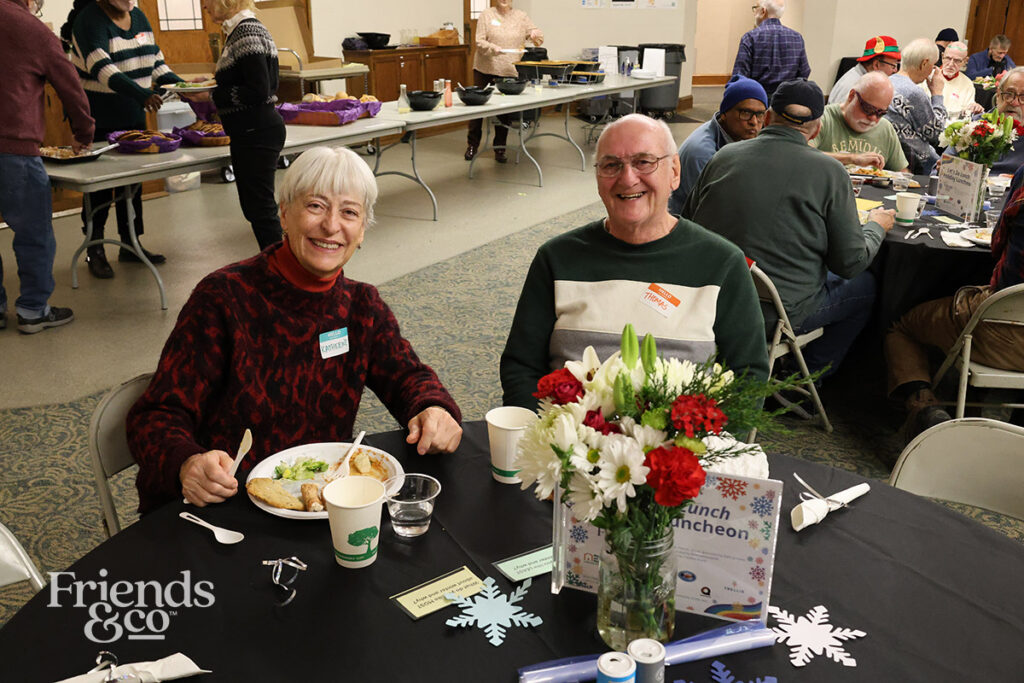 smiling at Friends & Co queer holiday luncheon for older adults in the Twin Cities 2025