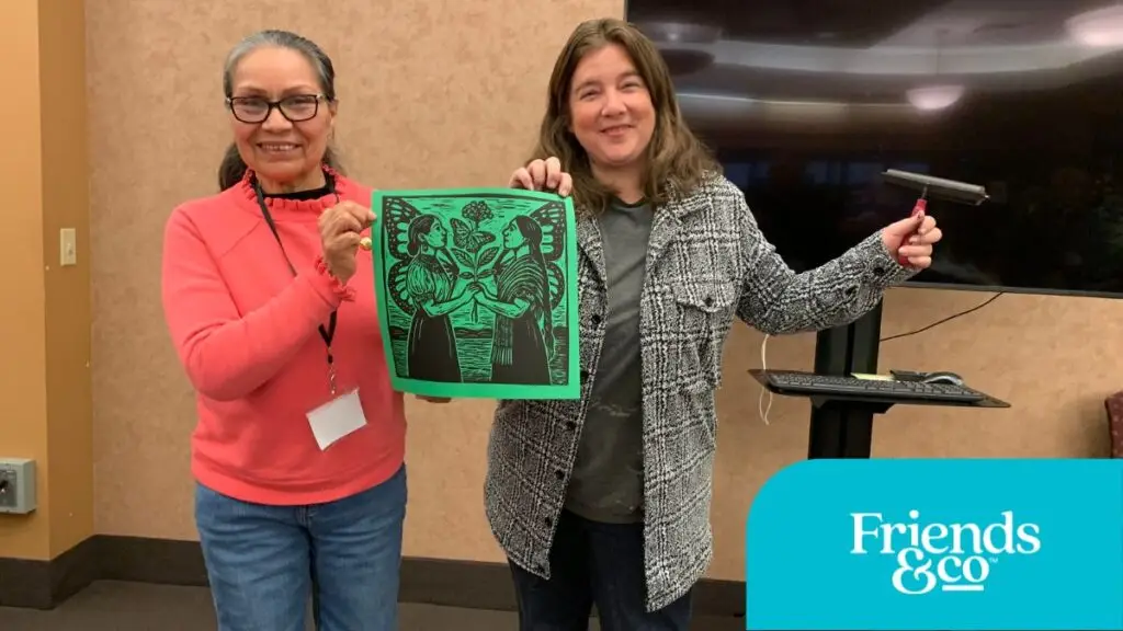 Older Adult with COMPAS Teaching Artist Constanza Carballon at Friends & Co Cafe Y Conversaciones