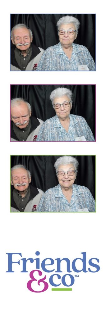 two elderly friends in photobooth at Friends By Your Side fundraiser by Friends & Co